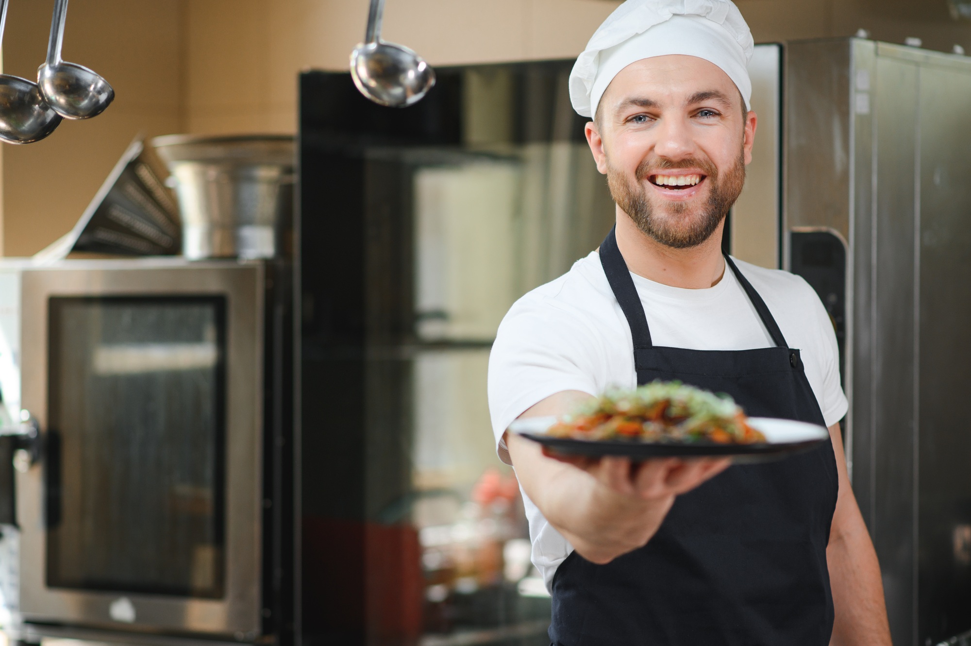 Smiling chef in his kitchen